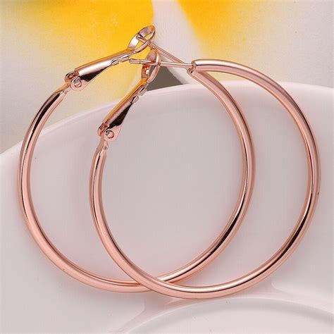 rose gold loop earrings sales.